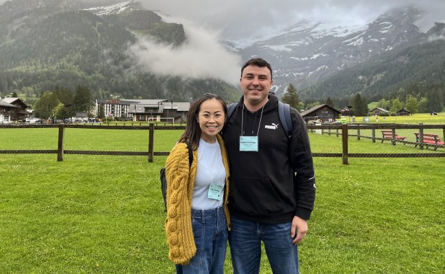 Chuong and Farmer standing in front of mountain in Les Diablerets, Switzerland.