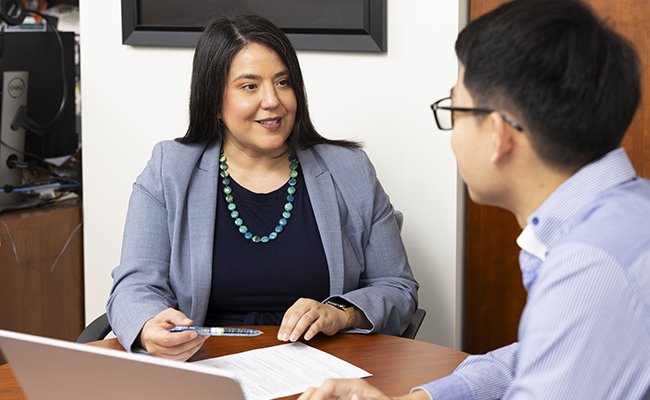 Salinas talking with student