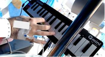 UTHealth Houston researchers observed as a brain tumor patient, who is also a musician, underwent an awake craniotomy while playing a mini-keyboard piano. (Photo provided by Elliot Murphy, PhD)