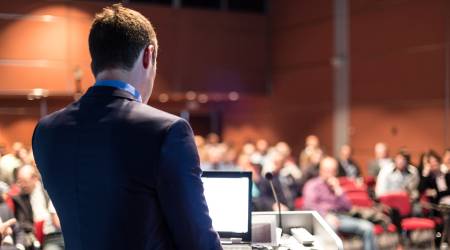  View of conference speaker as he faces his audience 