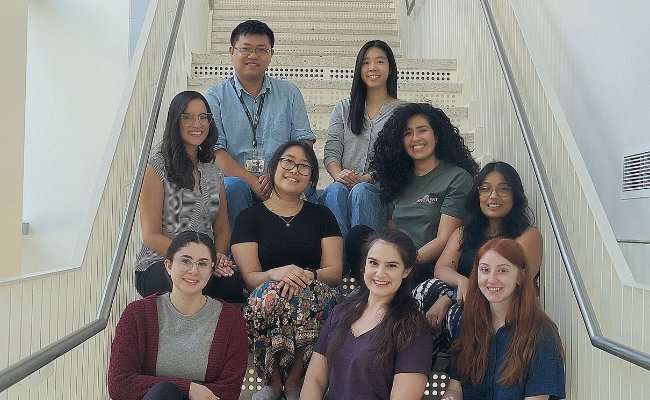 group of students sitting together on stairs