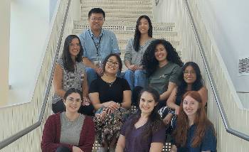 group of students sitting together on stairs