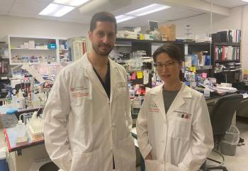 Study authors Mark J. Burish, MD, PhD, and Seung-Hee Yoo, PhD, stand in a lab at McGovern Medical School. (Photo by Caitie Barkley/UTHealth Houston)