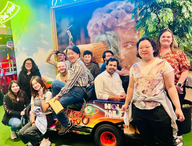 Members of Arur Lab posing for photo on Arur Lab day out at Holey-Moley 2025.