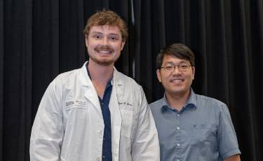 Sloan pictured with advisor Jayhun Lee, PhD at 2024 Lab Coat Ceremony.