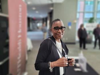 smiling woman in glasses