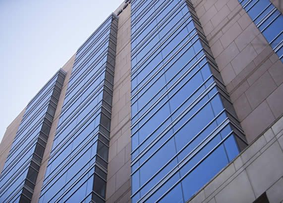 Photo looking up at the exterior of a building photo