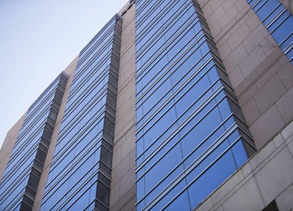 Photo looking up at the exterior of a building photo