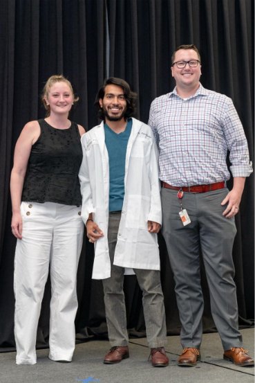 Jesus Duran-Ramirez at the 2023 Graduate School Lab Coat Ceremony with co-mentors Jennifer Walker, PhD, and Blake Hanson, PhD.