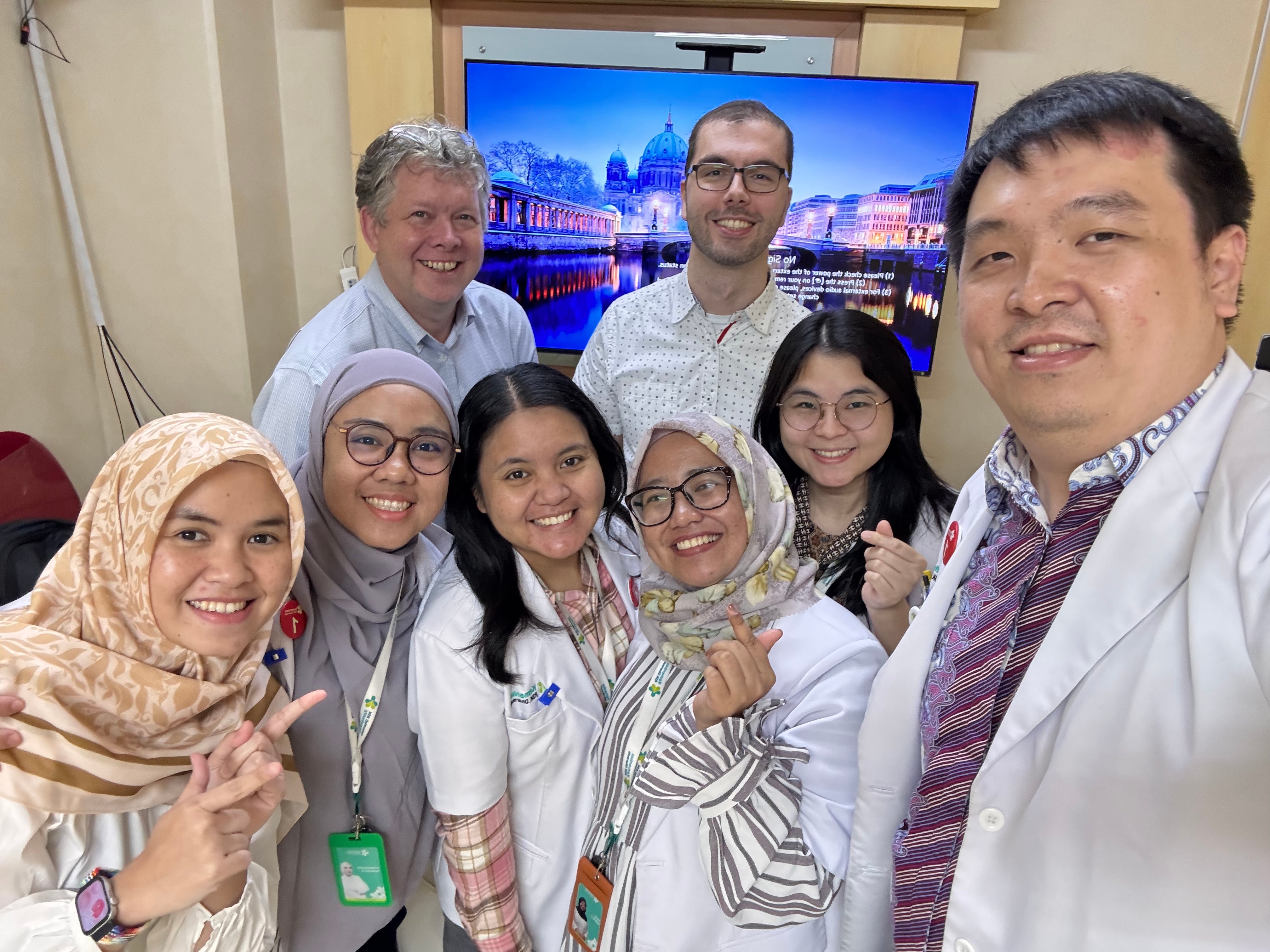 Gay with advisor Laurence E. Court, PhD, and six radiation oncology residents from Dharmais Cancer Hospital in Jakarta.