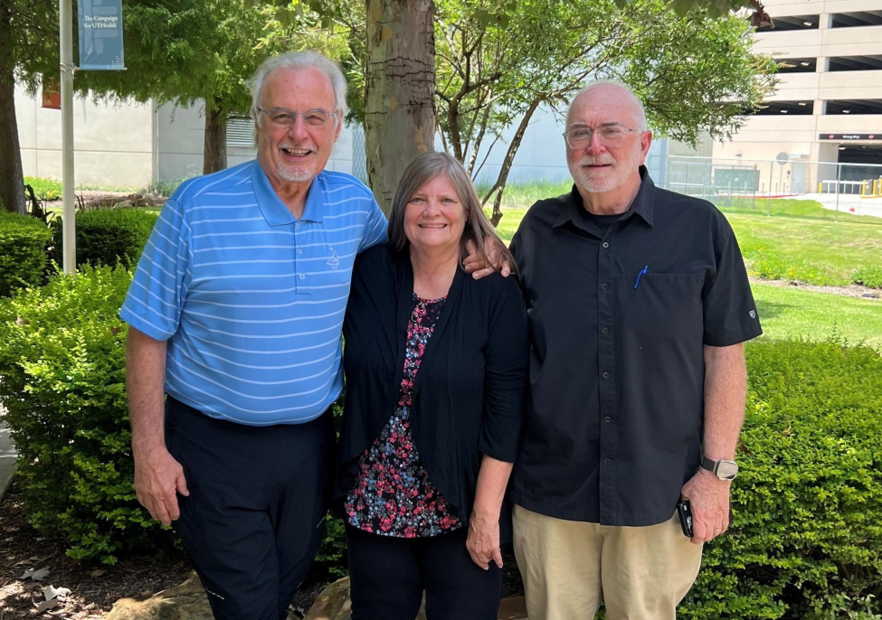 Alums John J. Kopchick, PhD ‘80, George Thornton, PhD ‘79, and Jacqueline Peltier Horn, PhD ‘79, standing and smiling.