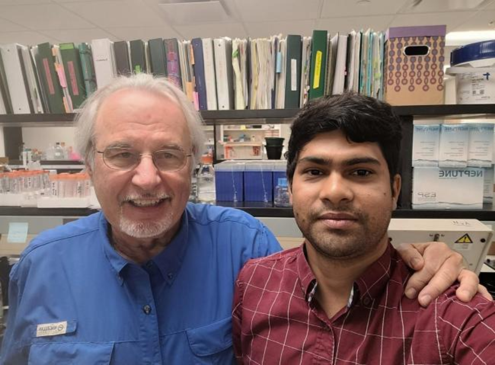 Ahammed with alumnus John J. Kopchick